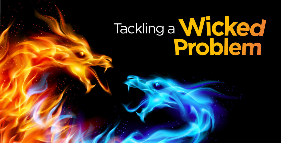 Tackling a Wicked Problem - orange and blue dragons made of flame facing each other against black background