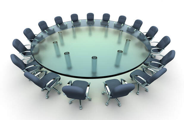 image of circular boardroom table
